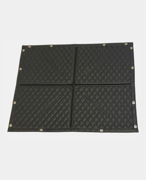 Black anti-slip floor mat with diamond pattern and brass eyelets at corners.