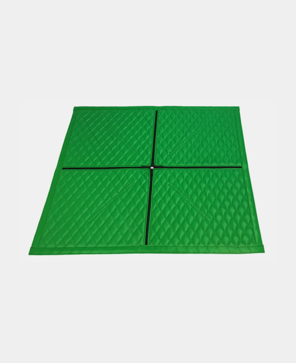 Four green interlocking foam tiles arranged in a square pattern on a white background.