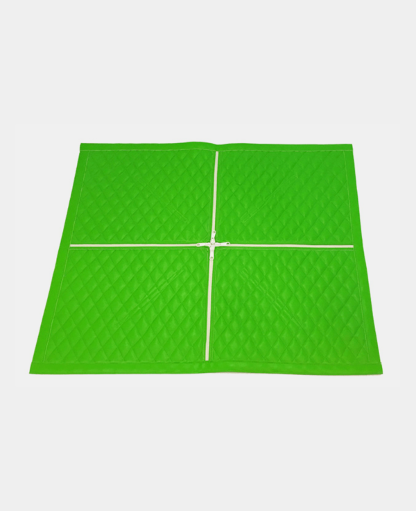 Green folding play mat isolated on white background.