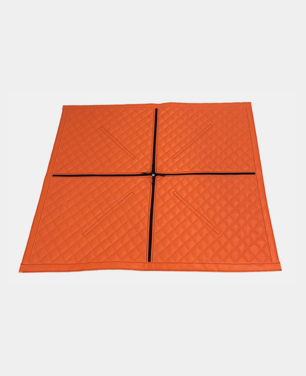 Four orange interlocking gym mats arranged on a white background.