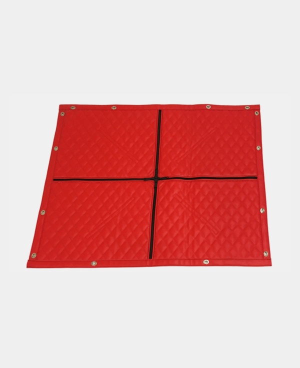 Red interlocking floor mats on a white background.
