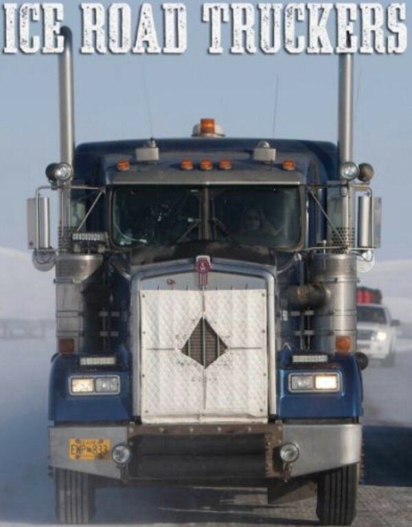 Semi-truck approaching on a snowy road with the Winter Front: Extreme Cold Weather Tail Option from the "ice road truckers" television series.
