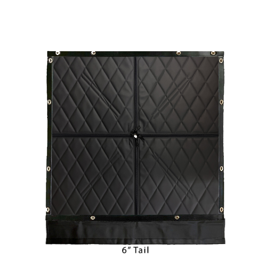 A black quilt with four squares on it.