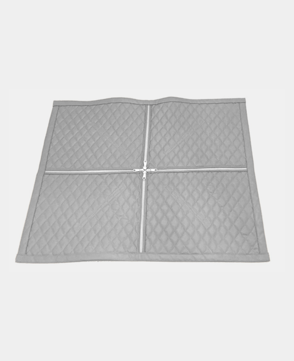 Quilted gray mattress protector spread out on a white background.