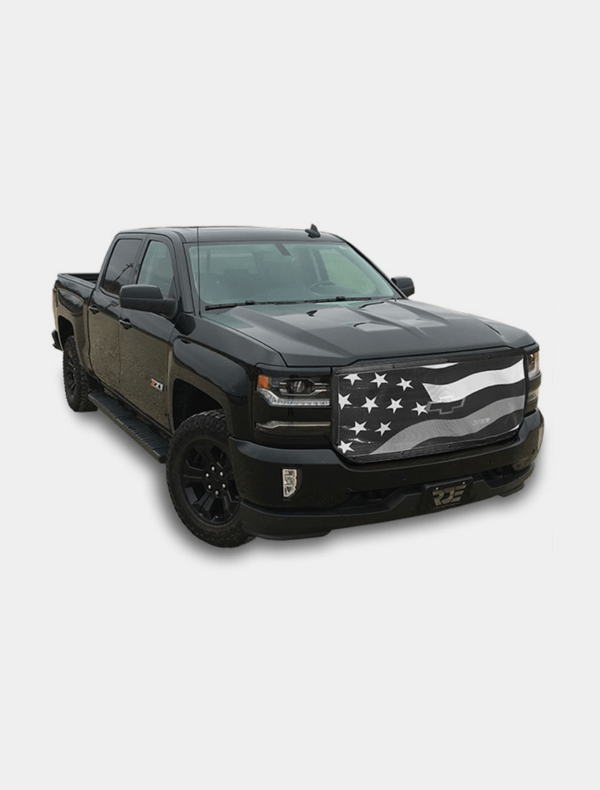 Black pickup truck with american flag graphics on the hood.