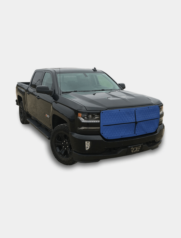 Black pickup truck with a blue grille cover parked on a white background.