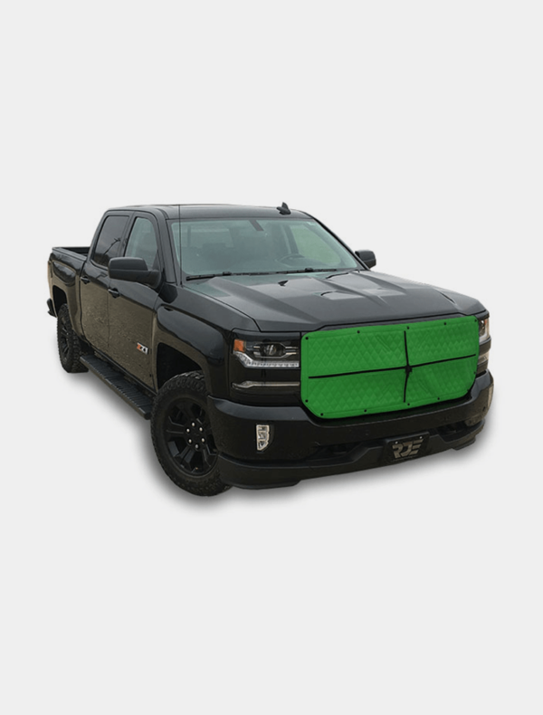 A black pickup truck with a green grille cover on an isolated background.