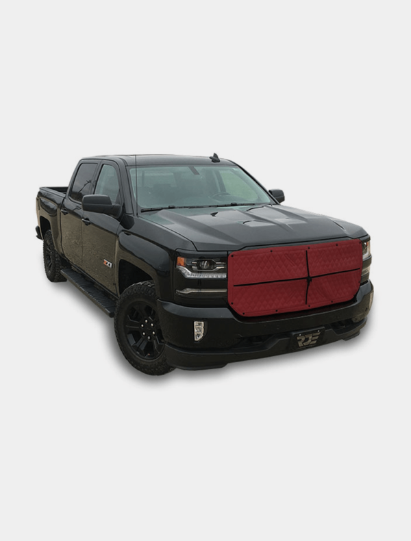 Black pickup truck with a red grille and custom headlights on a white background.