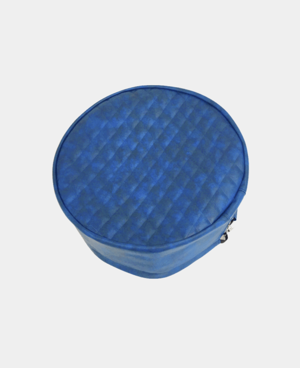 A blue, quilted round zippered case isolated on a white background.