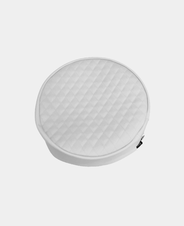 Round white cushion with quilted design on a white background.