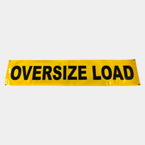 Yellow "oversize load" banner commonly used on vehicles transporting large, bulky cargo.