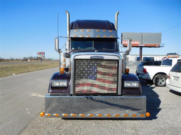 Old Glory-themed bug screen on a semi truck.