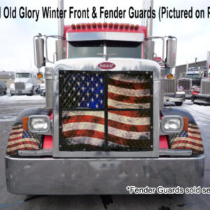 Semi-truck featuring a Winter Front: Heavy Duty Quilted 2-Zip Old Glory design on its front grille and fender guards in a snowy lot.