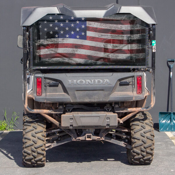 Rear view of a UTV/Side by Side with an american flag pattern on the back panel.
