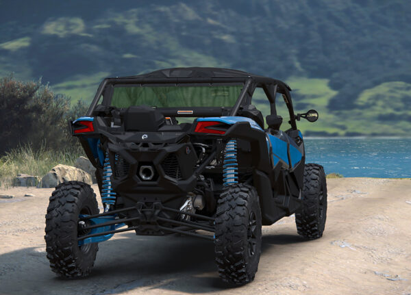 A blue and black four wheeler parked on the side of a road.