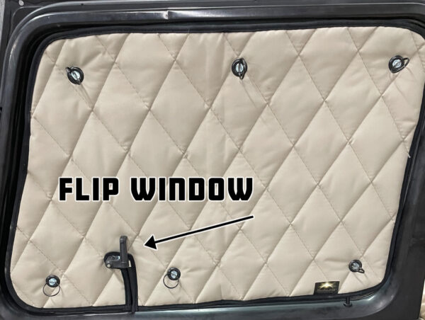 Quilted cover on a ZenEclipse Premium Window Covers for Semi Trucks with labeled direction arrow.