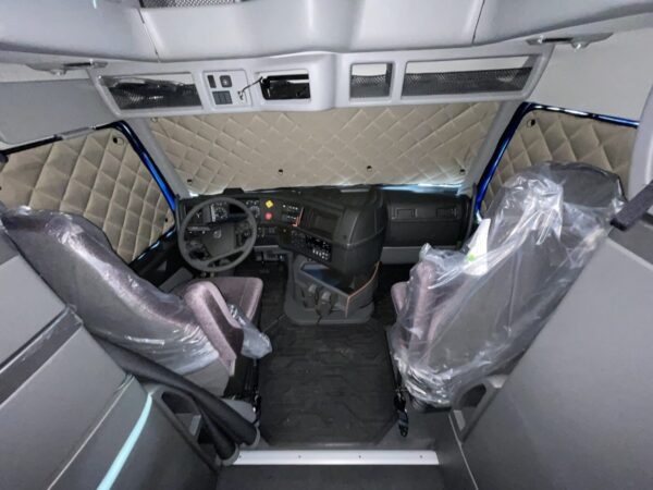 Interior of a truck cab with ZenEclipse Premium Window Covers for Semi Trucks.