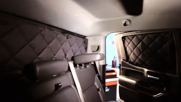 Luxury Bennett Trucking Nascar Discount ZenEclipse Pickup Truck interior with quilted leather upholstery and ambient lighting.