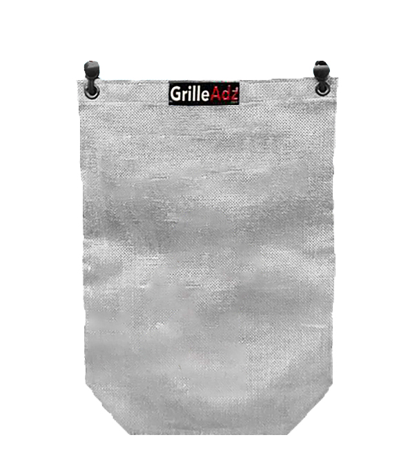 A grill age grill cover hanging on the wall.