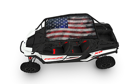 A white and black vehicle with an american flag on it.