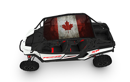 A white and black vehicle with a canadian flag on it.