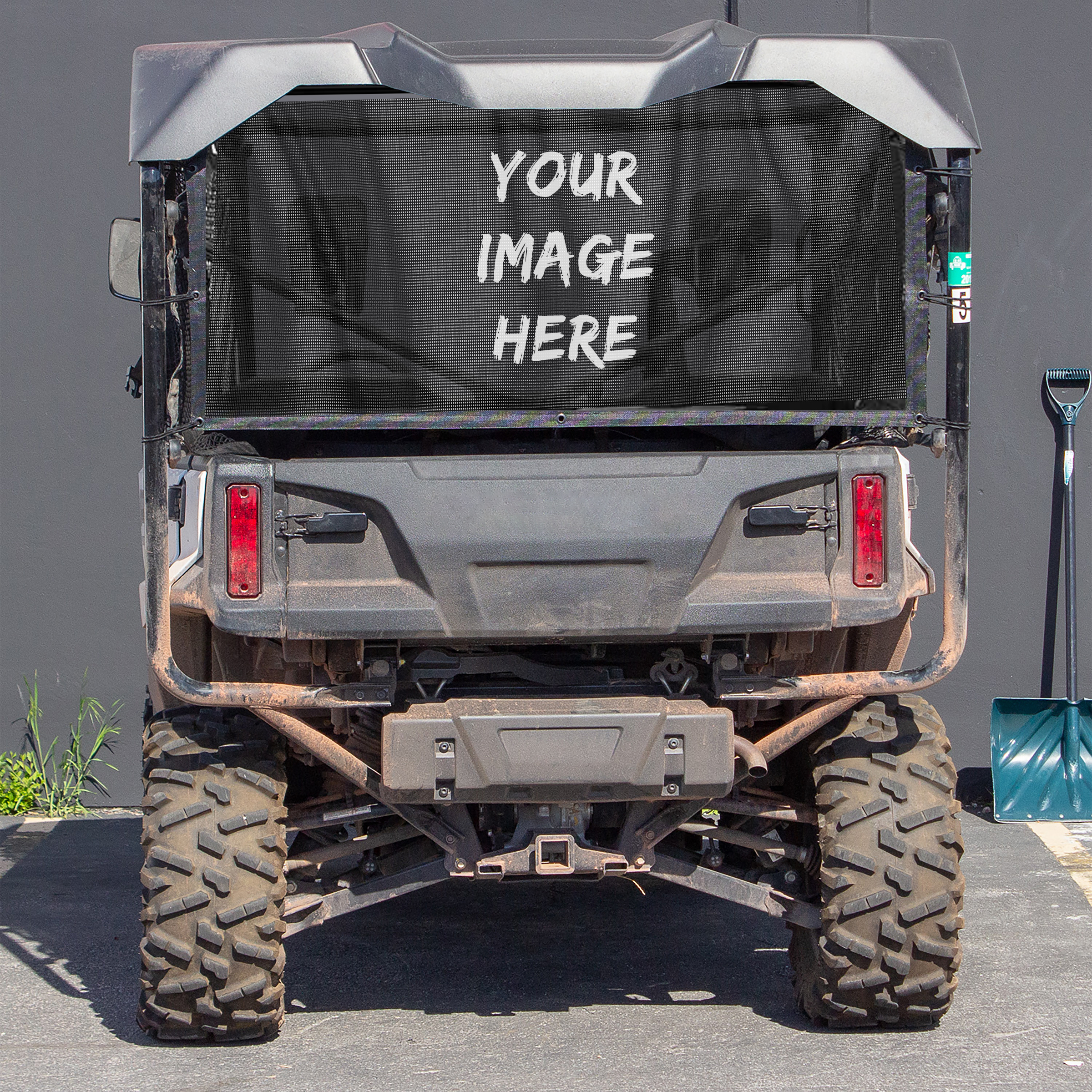 Rear view of an off-road vehicle with a UTV/Side by Side Rear Dust Screen-CUSTOM IMAGE on the spare tire cover.