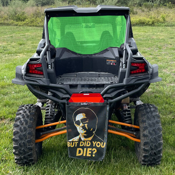 Here's an alt tag for the image: Off-road vehicle with funny meme flag.